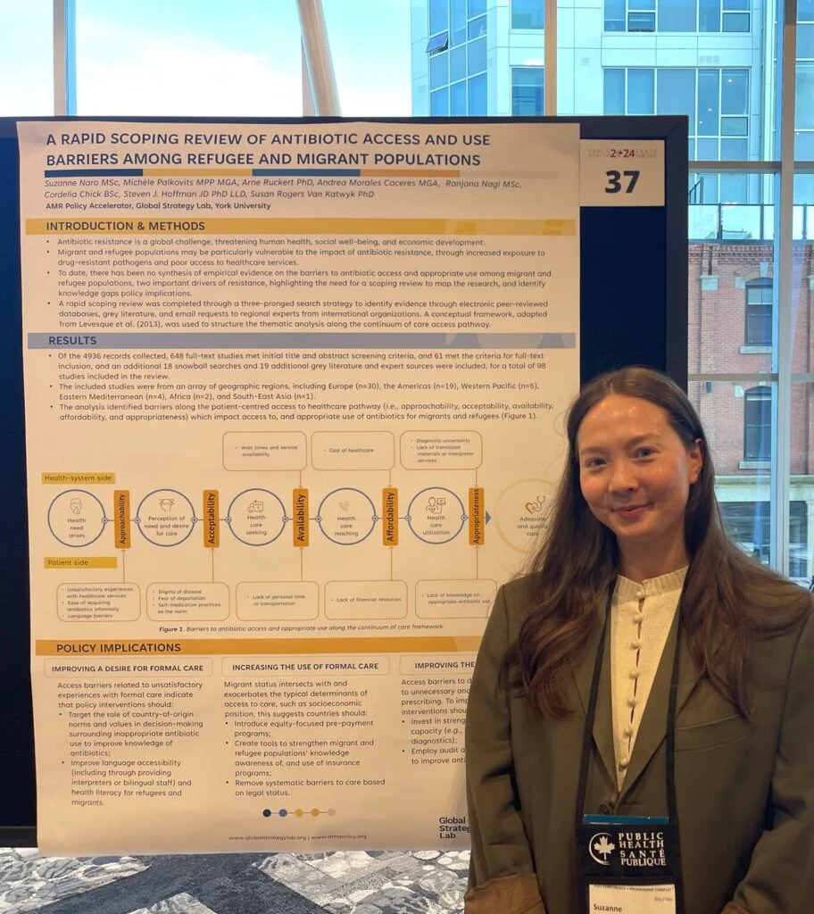 Policy Advisor Suzanne Naro stands in front of a poster presentation at the Canadian Public Health Association (CPHA) 2024 conference. 