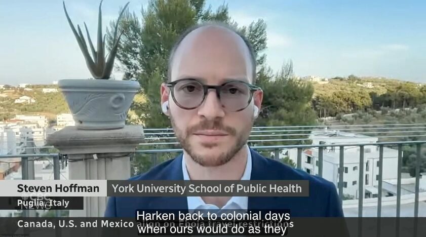 Steven J. Hoffman conducting an interview with CBC News on the 90-day travel bans.
